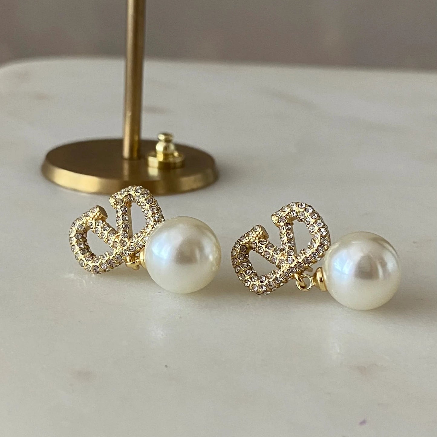 V pearl earrings
